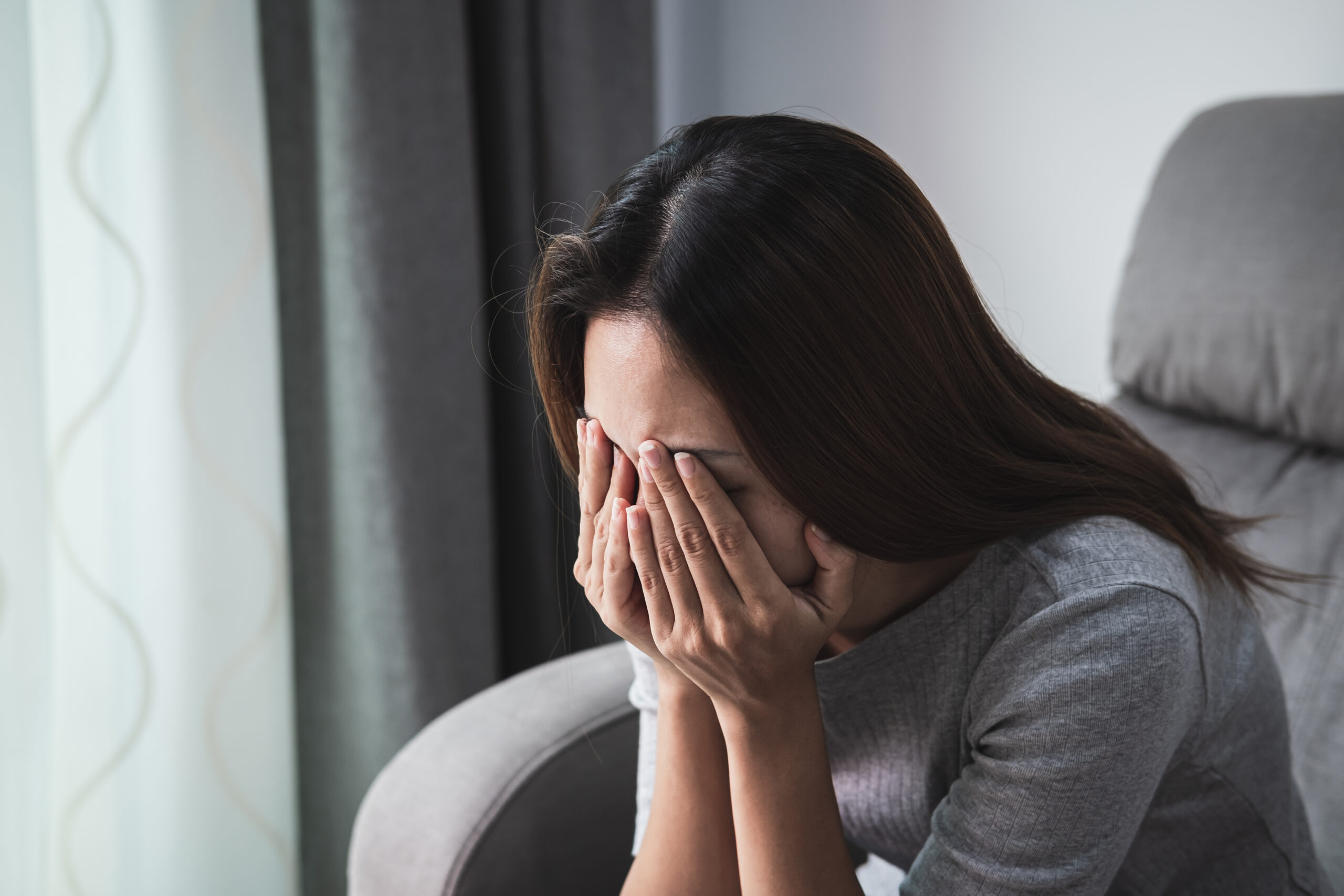 Depressed and sadness woman crying alone at home